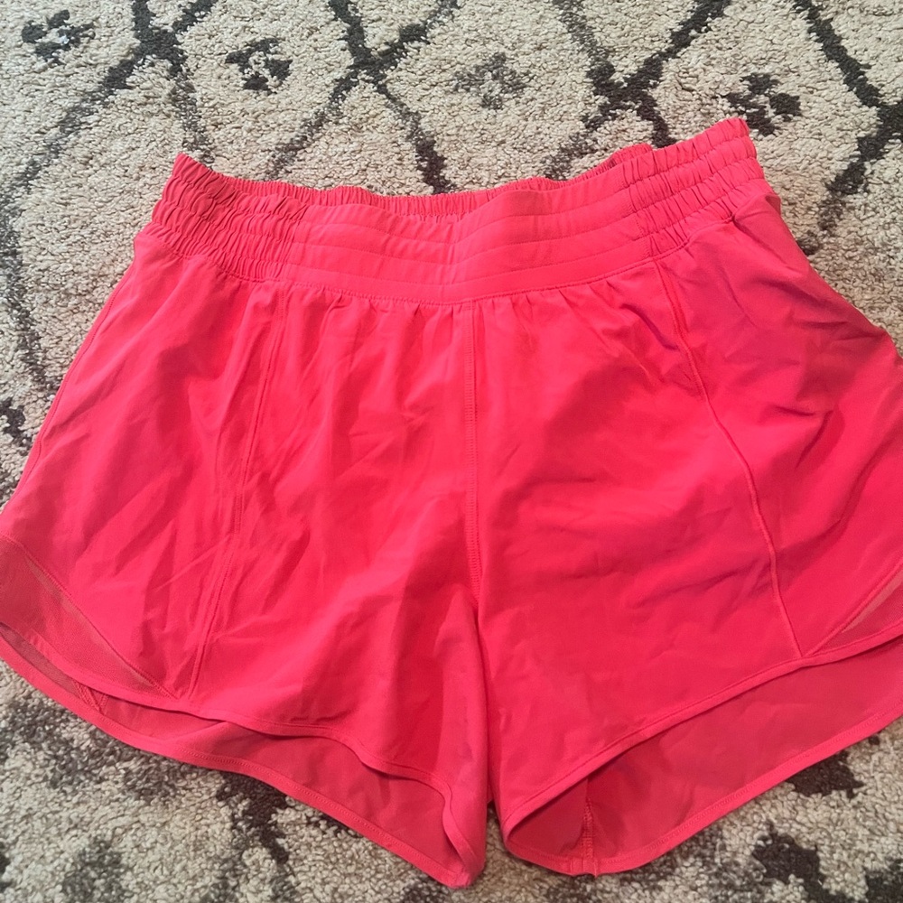Hot pink lululemon shorts, color lip gloss.